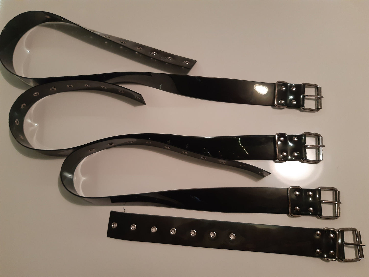 Set of 8 bondage belt in black PVC