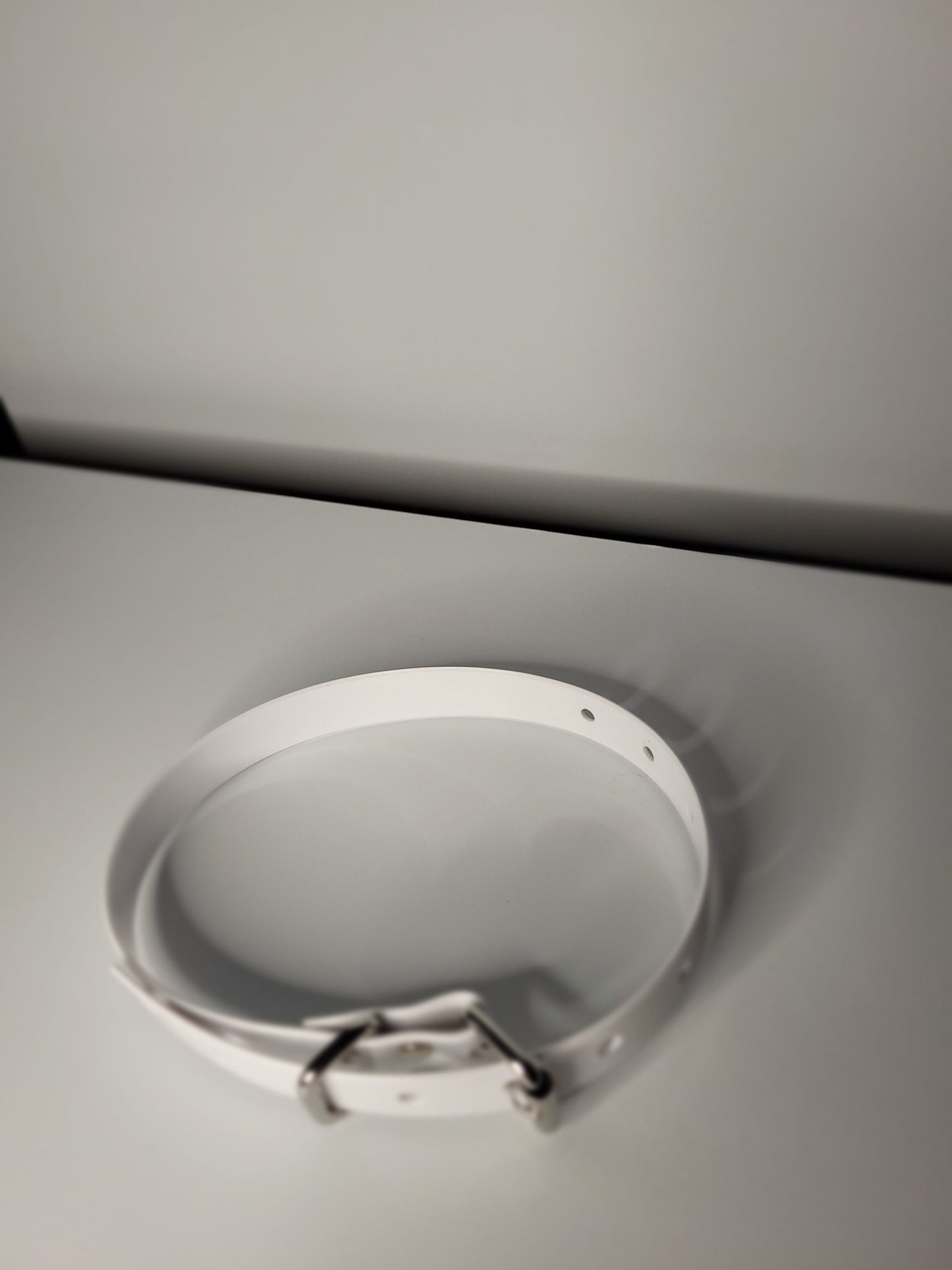 Thin bondage belt in white PVC