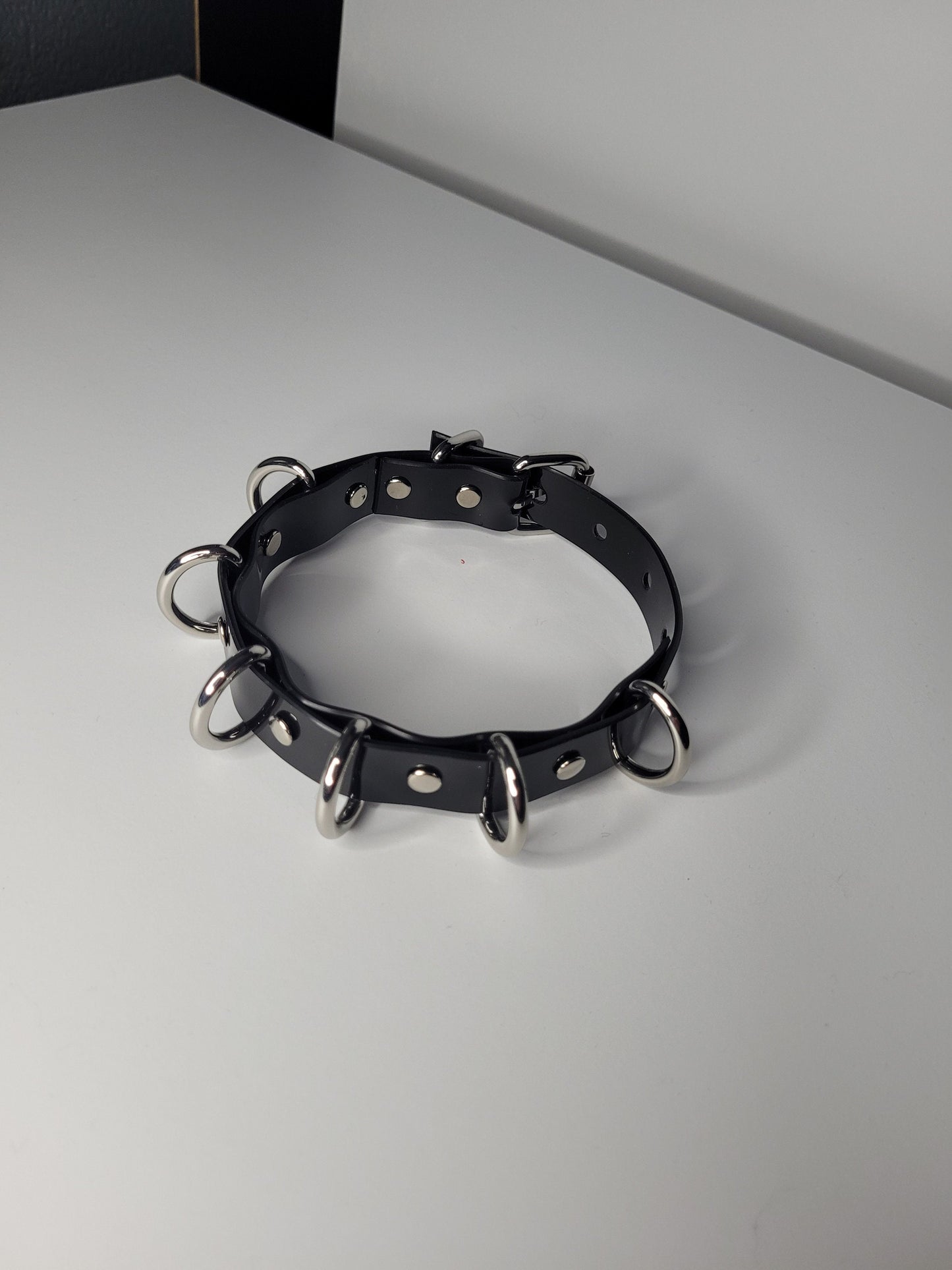 Black PVC neck collar multiple D ring inspired by Rhea Ripley