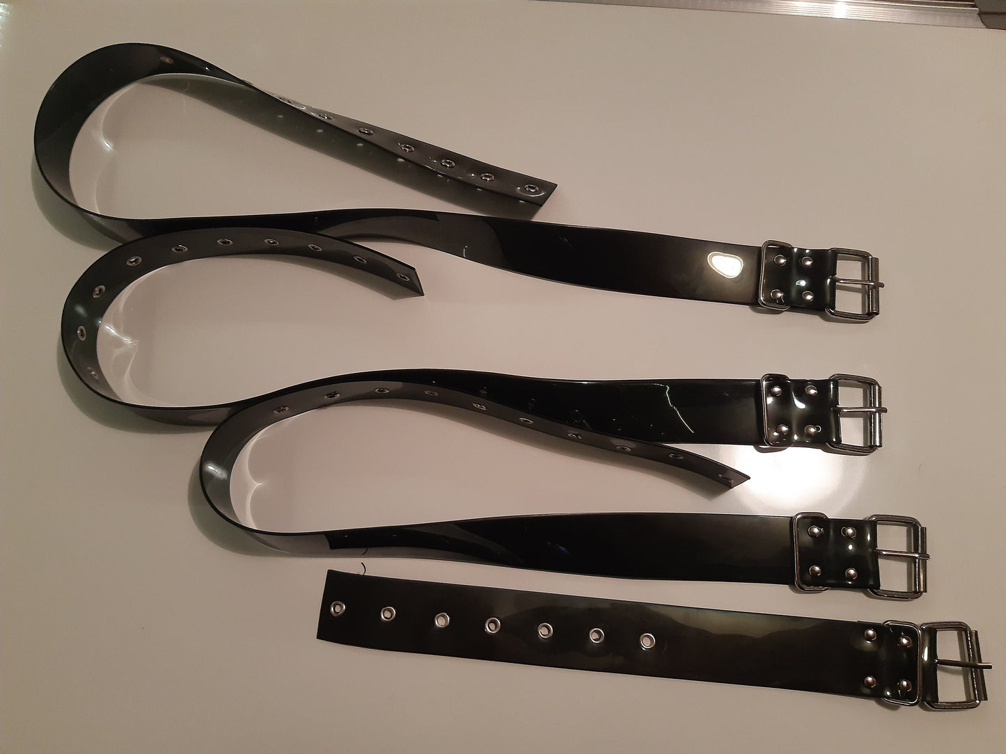 Set of 8 bondage belt in black PVC
