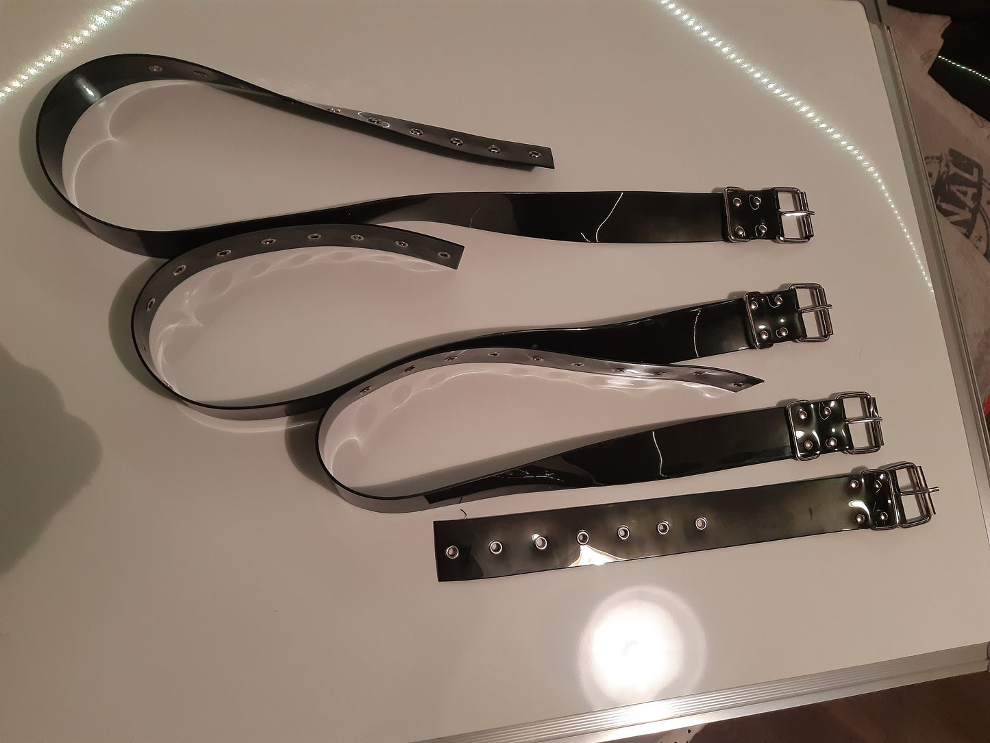 Set of 8 bondage belt in black PVC
